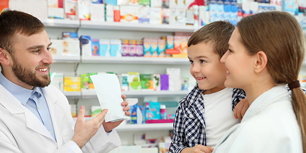 Mother and toddler with pharmacist